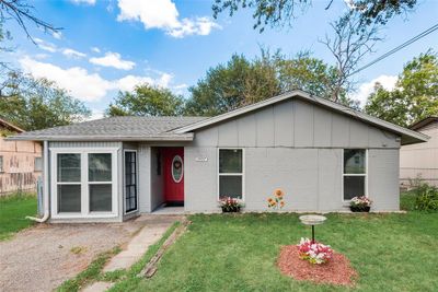 Ranch-style home featuring a front lawn | Image 1