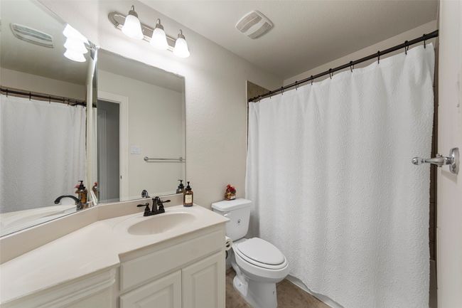 Full bathroom featuring toilet and vanity | Image 26