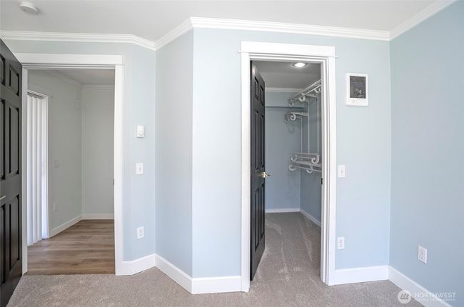 An exciting detail about the Primary Bedroom: it is beautifully complemented by a spacious walk-in closet. This feature offers ample storage and organization potential, significantly enhancing the functionality and appeal of the room. | Image 14