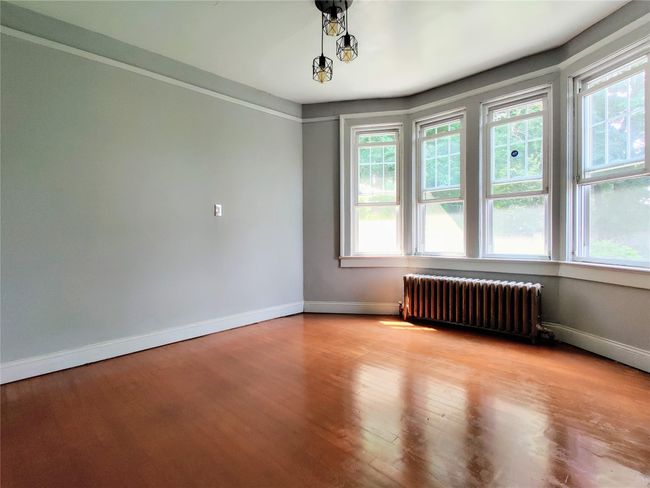 Empty room featuring baseboards and tile patterned floors | Image 17