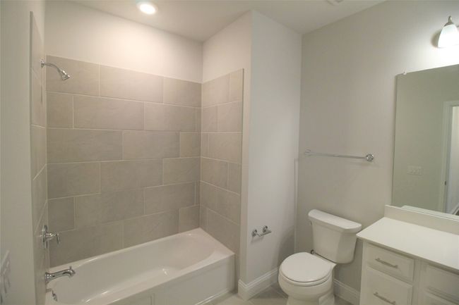 2nd Full bath with vanity, toilet, baseboards, and shower / bath combination | Image 11