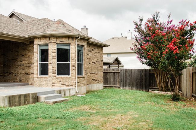 View of fenced backyard | Image 34