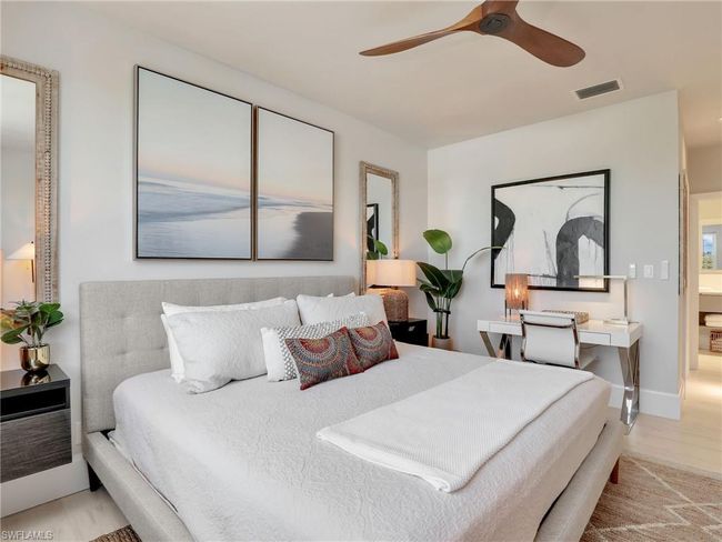 Bedroom with wood finished floors and a ceiling fan | Image 9