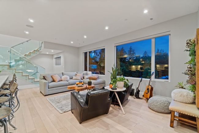 Living area featuring light wood-style floors, stairway, recessed lighting, and baseboards | Image 9