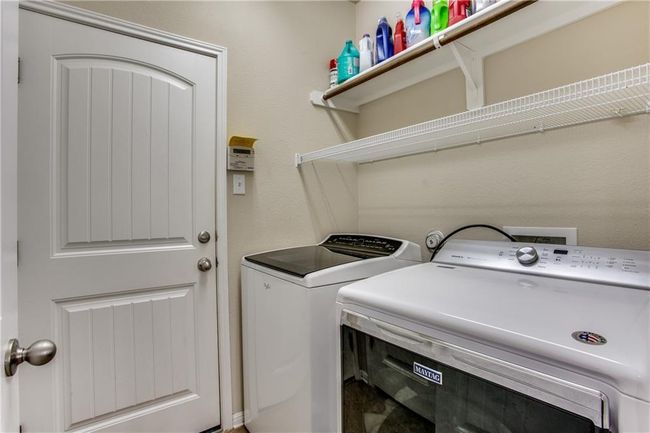 Washroom with washing machine and clothes dryer | Image 21