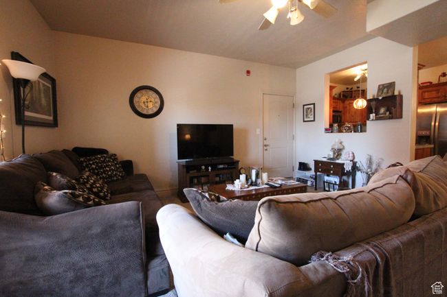 Living room with ceiling fan | Image 4