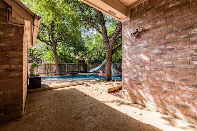 Patio leading out to pool | Image 27