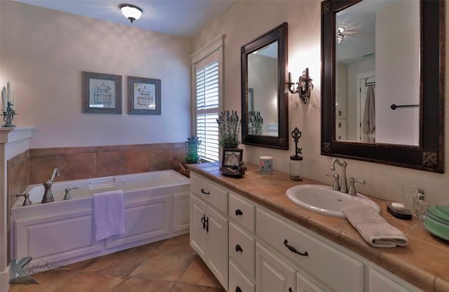 Bathroom with vanity and a garden tub | Image 26