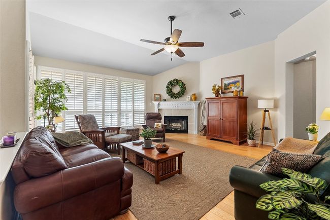 The living area at the back of the home boasts elevated views, filling the space with natural light while offering a picturesque backdrop | Image 9