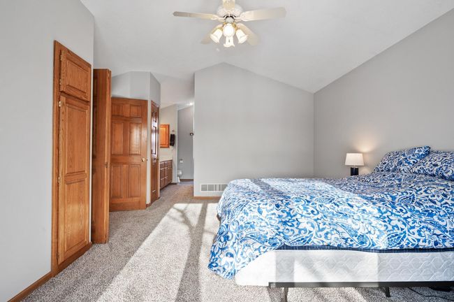 Here is an alternate view of the owner's suite. The 6 panel solid wood double entry doors open to a catwalk that leads to the 3 additional bedrooms and second full bathroom on the upper level. | Image 19