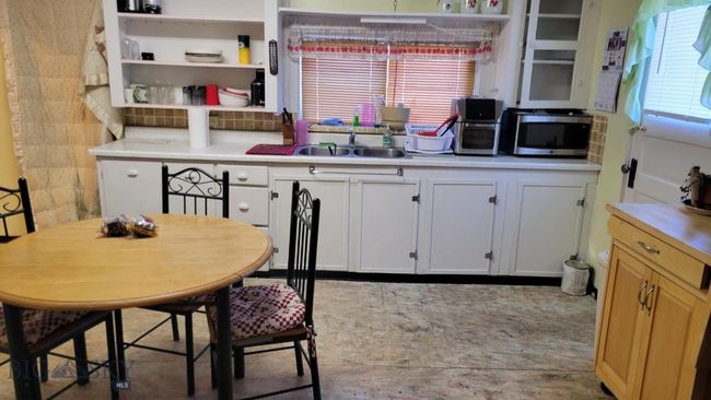 Kitchen with white cabinets and sink | Image 4