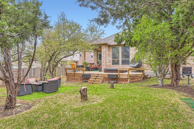 View of yard with a deck and fence | Image 32