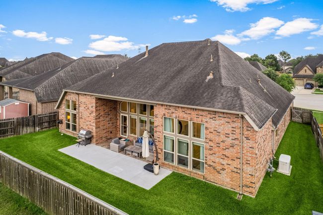Come and see this spacious backyard with its beautiful covered patio. There is plenty of room for the kids to play and adults to relax! Perfect for your outdoor living space, patio furniture, bbq pit, and so much more. The possibilities are endless! | Image 31