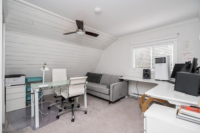 Office with lofted ceiling, light colored carpet, a ceiling fan, and ornamental molding | Image 37