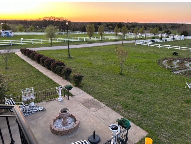 Yard at dusk featuring a rural view | Image 5