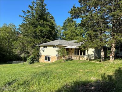 Rear view of house with a lawn | Image 2