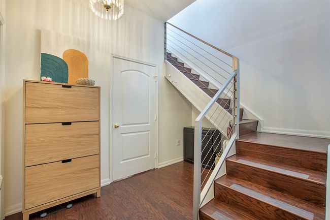 Stairway with wood finished floors and baseboards | Image 12