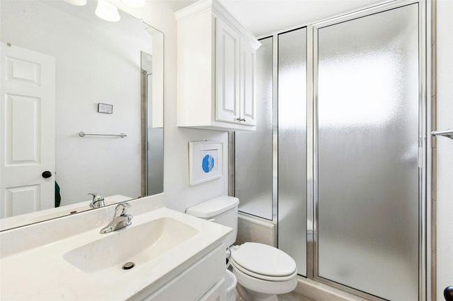 Bathroom with vanity and a shower stall | Image 25
