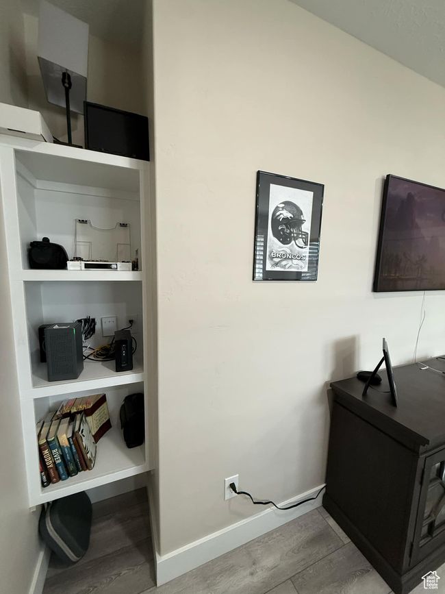 Interior space featuring baseboards and wood finished floors | Image 20