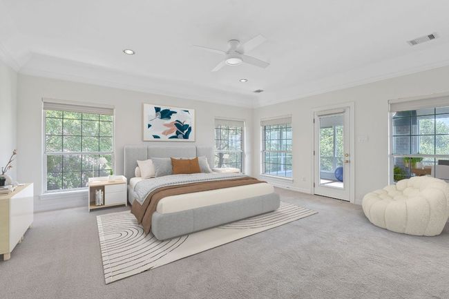 This is a large primary bedroom with Silhouette window treatments, lots of natural light and a glassed walled office attached. (Virtually Staged) | Image 9