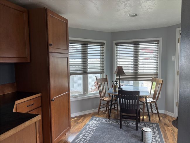 Dining room featuring baseboards and wood finished floors | Image 17