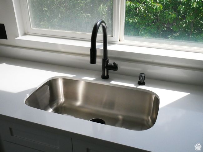 Kitchen view of a sink | Image 8