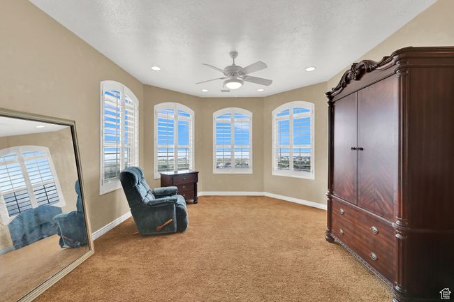 Sitting room featuring ceiling fan, light carpet, baseboards, and recessed lighting | Image 29