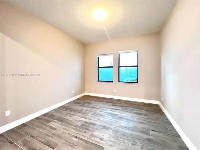 12070 - 12070 N Baypoint Cir, House other with 3 bedrooms, 2 bathrooms and null parking in Parkland FL | Image 22