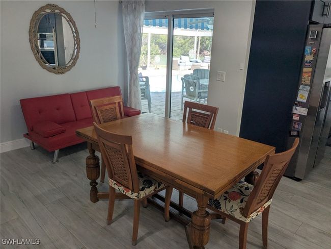 Dining room featuring baseboards and light wood finished floors | Image 21