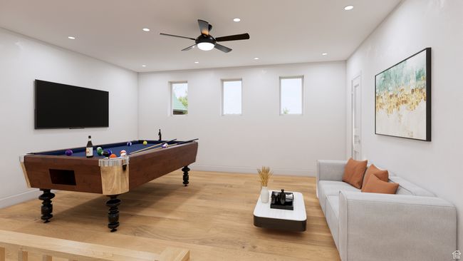 Game room with wood finished floors, a wealth of natural light, pool table, and a ceiling fan | Image 12