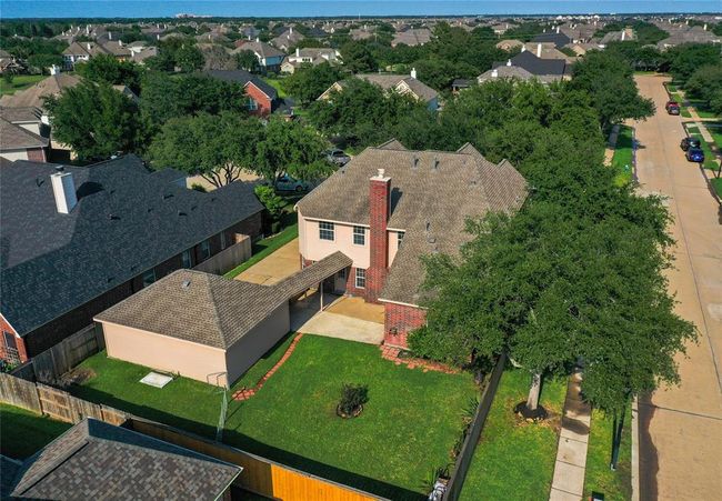 Discover a spacious backyard oasis, perfect for relaxation and outdoor gatherings. | Image 45