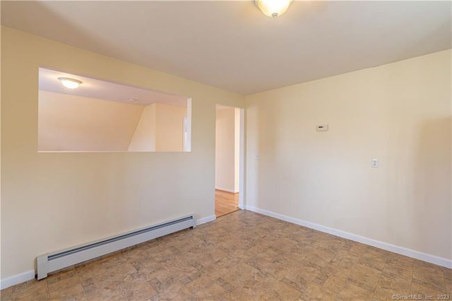 View of kitchen looking into bedroom/dining/office area... | Image 16