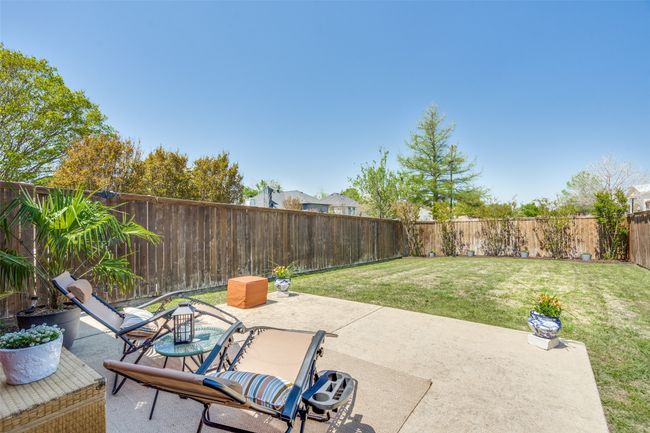 The extended patio provides additional space for relaxation and fun. Crepe Myrtle trees across the back fence will be blooming beautifully before long! | Image 7