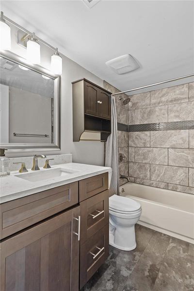 Full bathroom with vanity, shower / tub combo, and toilet | Image 3