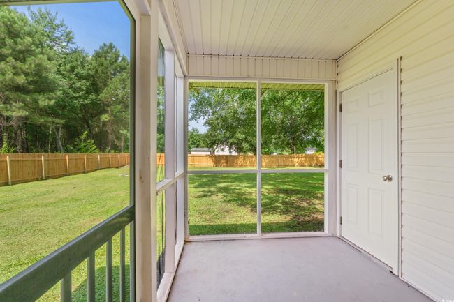 View of unfurnished sunroom | Image 25