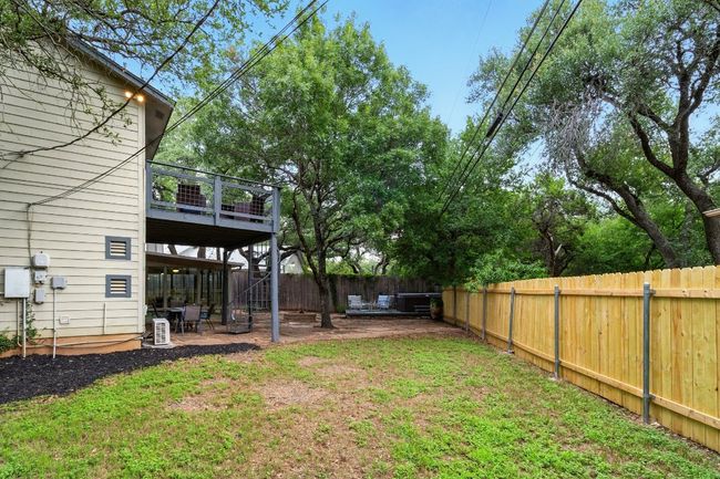 The oversized side yard offers room for games, pets, or gardening, all under the shade of mature trees. | Image 25