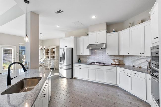 Chefs kitchen open to family room | Image 23