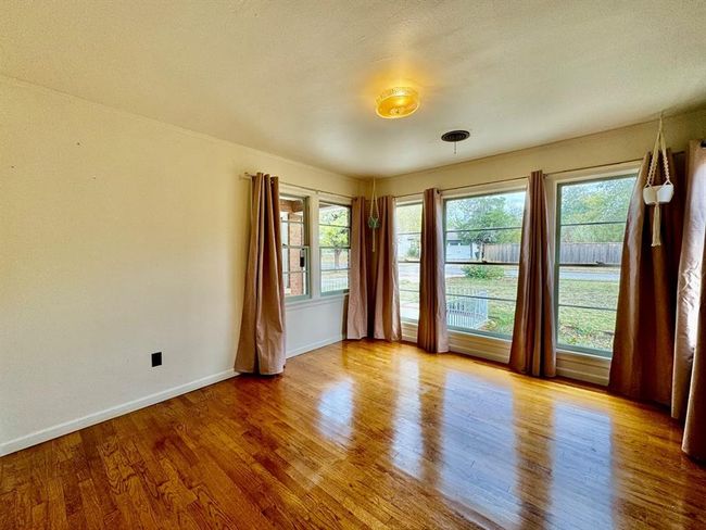 Empty room with wood finished floors and healthy amount of natural light | Image 19