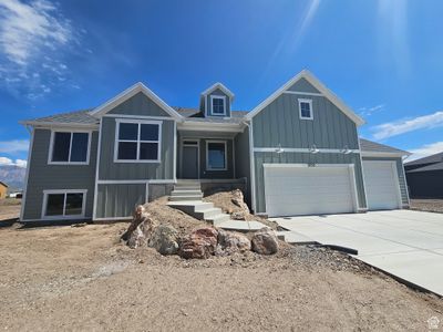 View of front facade featuring a garage and covered porch | Image 2