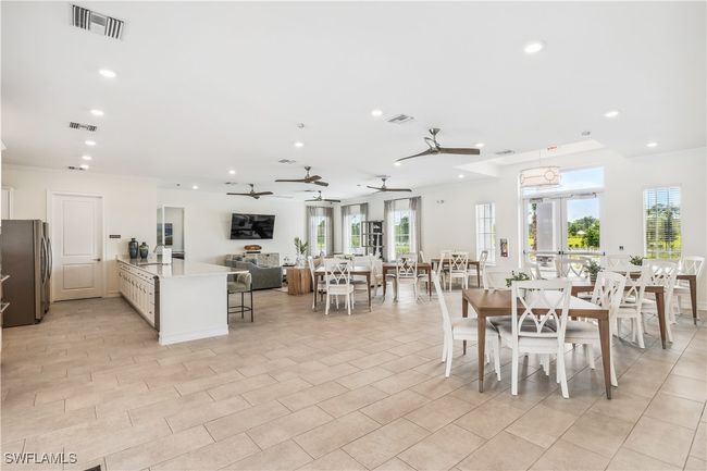 Dining area with ornamental molding and sink | Image 5
