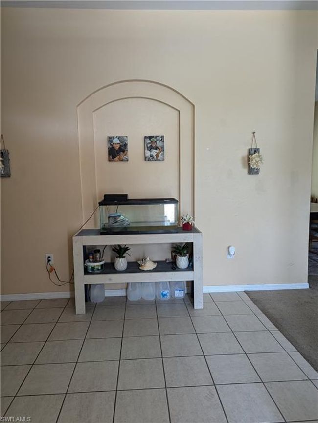Detailed view of baseboards and arched walkways | Image 5