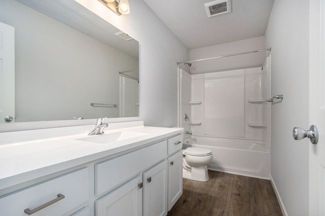 There is full bathroom is centrally located and has a tub/shower combo. | Image 16