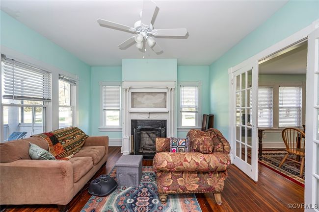 Dining space featuring baseboards and wood finished floors | Image 11