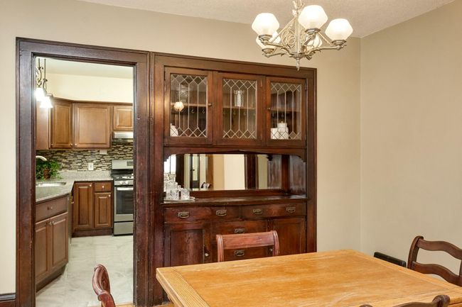 Dining area looking into kitchen | Image 9