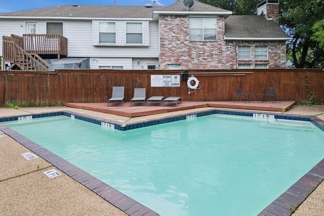 Community pool with a deck | Image 28