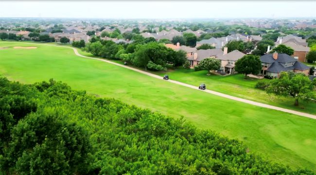 Aerial view of residential area featuring a golf course | Image 36