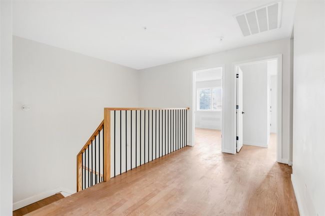 Hallway with light wood-type flooring | Image 36