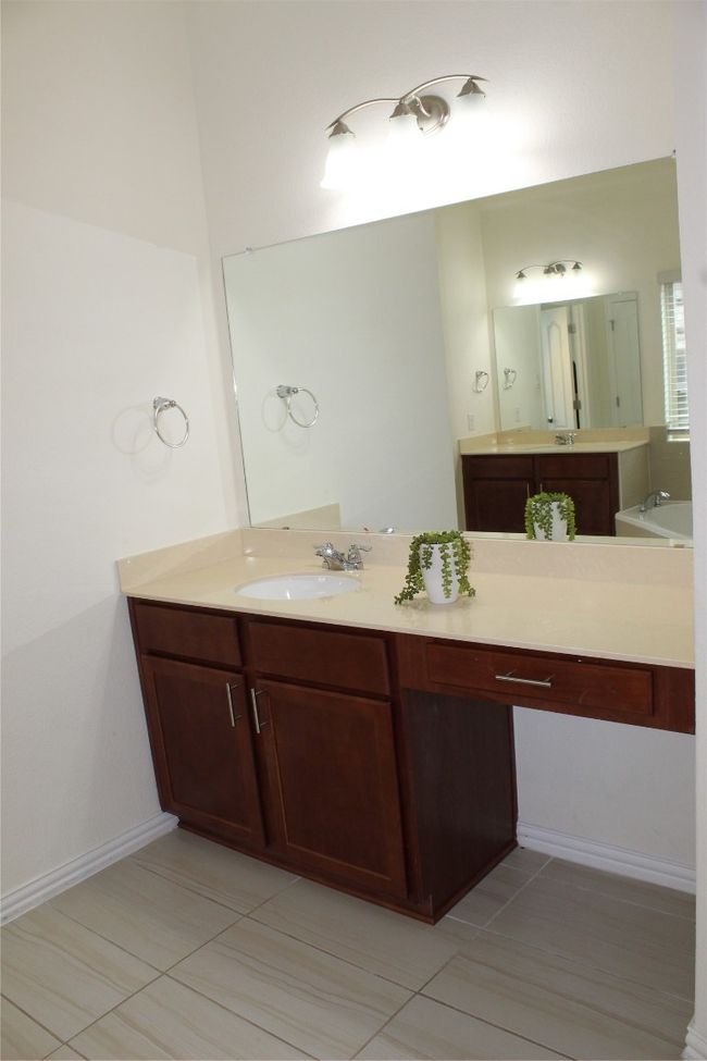 Bathroom with tile patterned flooring and vanity | Image 23