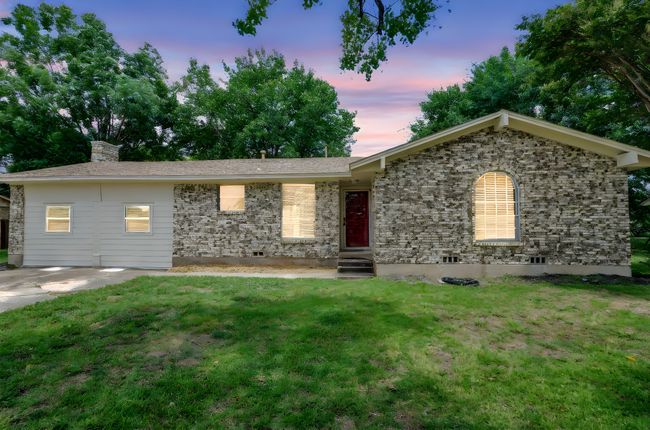 Ranch-style home featuring a lawn and a chimney | Image 21