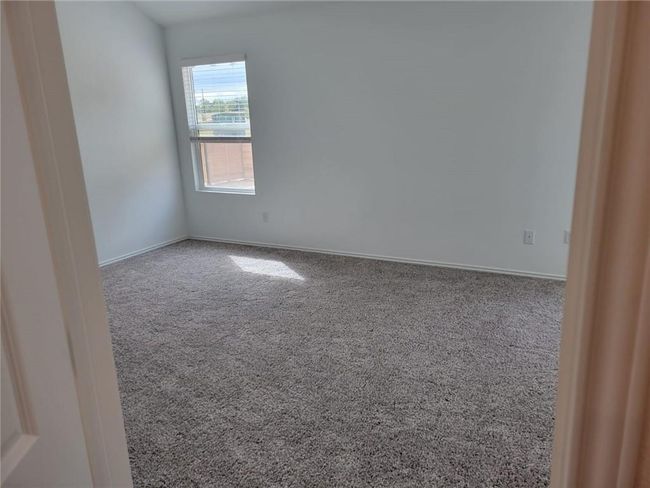 Unfurnished room featuring carpet floors and baseboards | Image 23